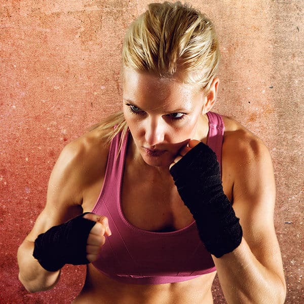 Mixed Martial Arts Lessons for Adults in Randolph __STATE__ - Lady Kickboxing Focused Background