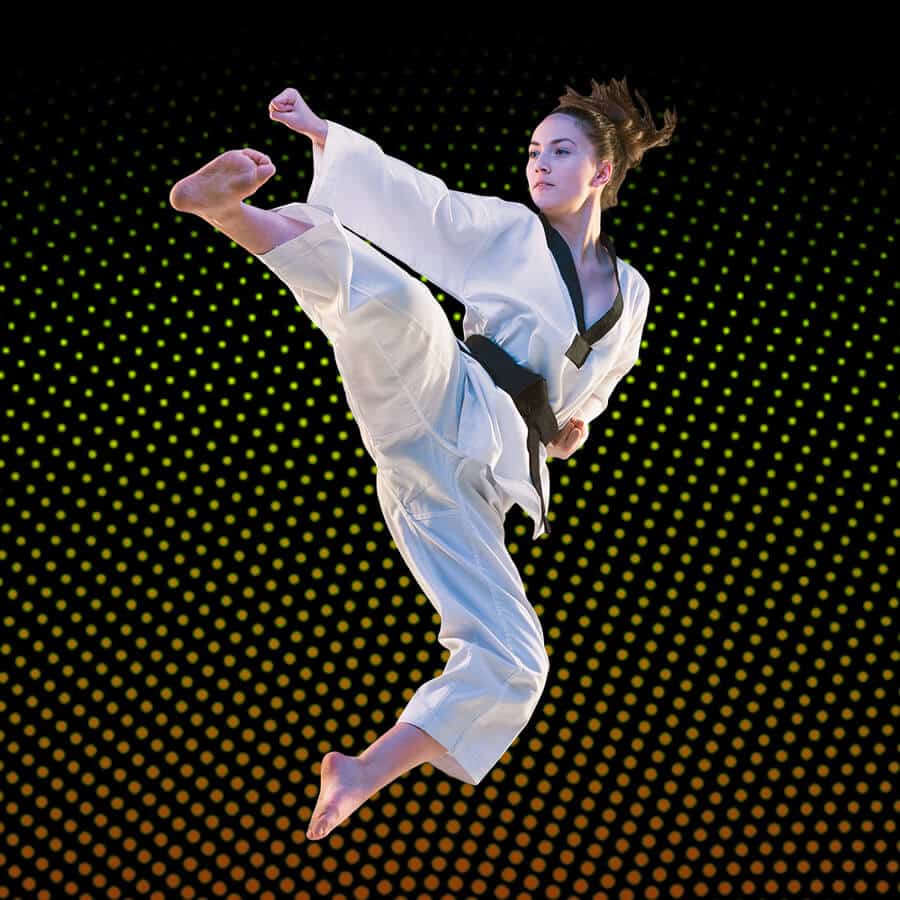 Martial Arts Lessons for Adults in Randolph __STATE__ - Girl Black Belt Jumping High Kick